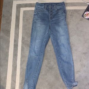 Blue skinny jeans with button detail